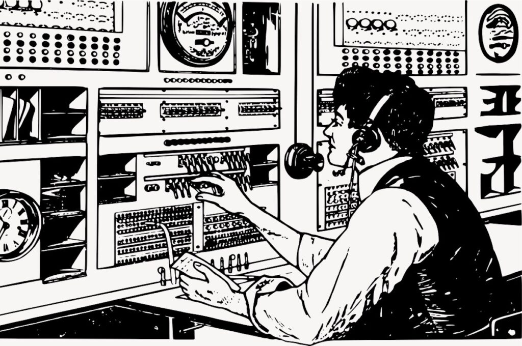 A radio operator turns knobs on a vintage broadcasting setup.